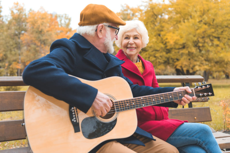 Senior learning guitar