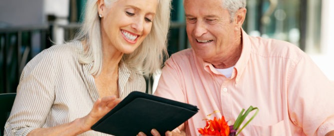 Senior couple researching retirement communities