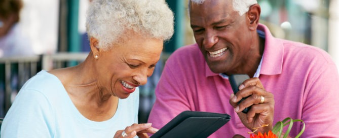 senior couple using tablet