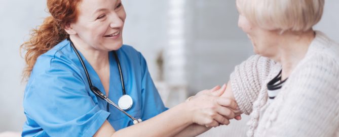 Nurse massaging the arm of the senior lady. What qualifies a patient for skilled nursing care.