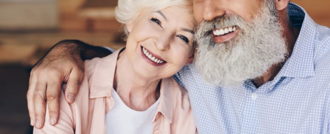 Elderly couple smiling together